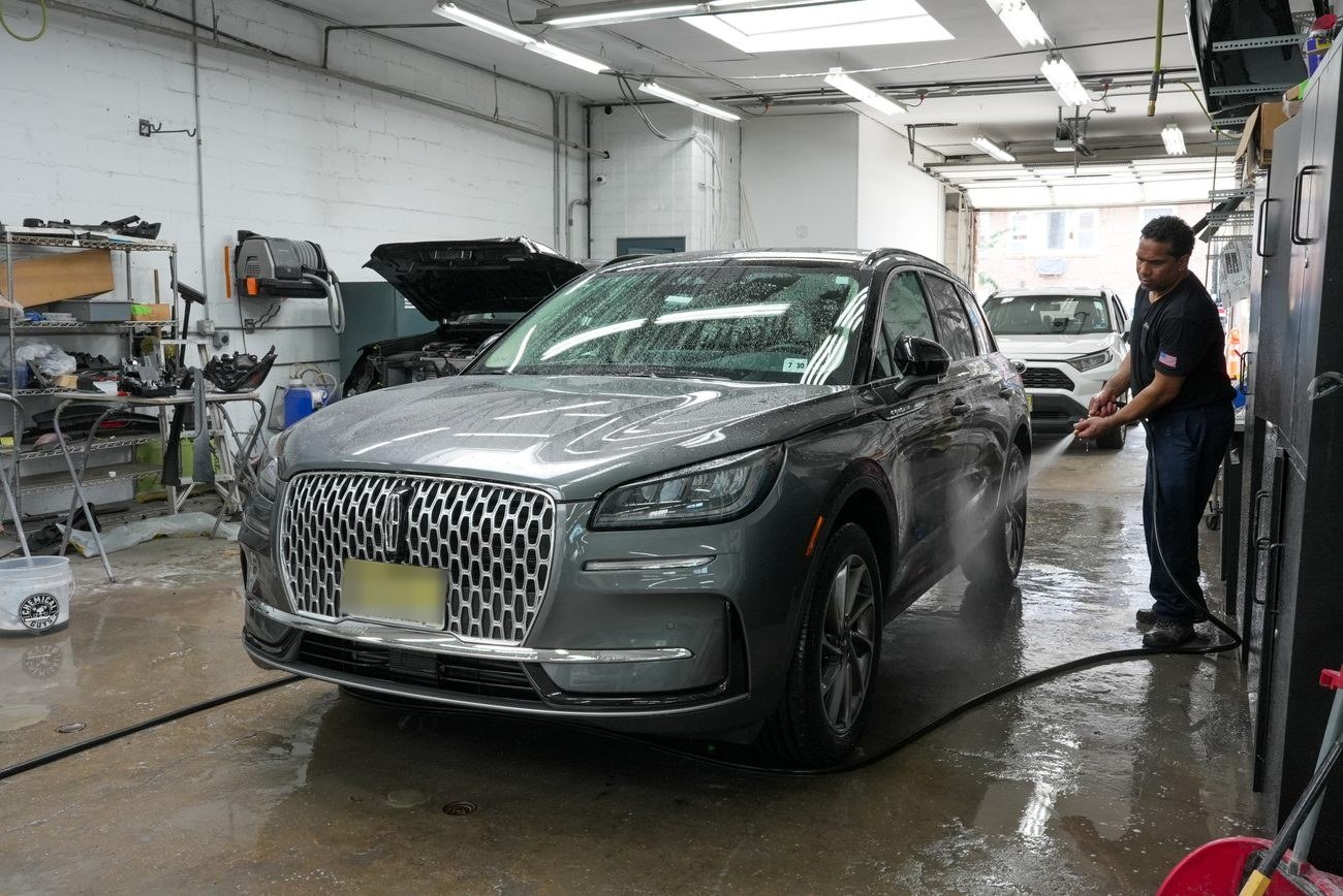 A car being cleaned and detailed at Guttenberg Auto Body